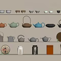 Display of Tea Set on Shelves with Various Colored Teapots Teacups Tea Cakes and Caddies