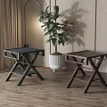 Two Wooden Stools With X Shaped Legs In Indoor Space With Potted Plant And Bookshelf