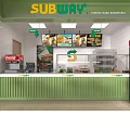 Subway Restaurant Green Kiosk Interior With Yellow Chairs Tables And Menu Boards