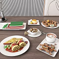 Plated Assorted Foods Pasta Desserts Cookies Coffee Donuts And Nuts On Wooden Table