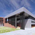 Modern Office Building With Red Brick Exterior Glass Facade And Staircase