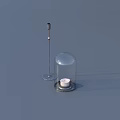 Transparent Glass Dome With Lit White Candle And Metal Slender Object On Light Blue Background