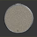 Weathered Multi level Tower Building With Rimmed Top Round Windows And Textured Stone Base