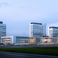 Modern Hospital Building With High Rise Structure Glass Curtain Walls And Main Entrance Signage
