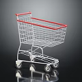 Metallic Shopping Cart With Red Handle And Four Wheels On Black Surface