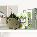 Green Dinosaur Plush Doll On Shelf With Books Calendar Storage Box And Lamp