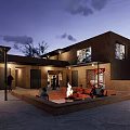 Earthen Courtyard Architecture With Open Space Fire Pit People Sitting And Trees