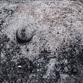 Burnt Garden Ornament Area With Black Ash White Residues Small Stones And Debris