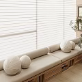 Cozy Window Seat With White Blinds Round Cushions Wooden Drawers And Green Plant