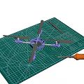 Purple Electric Toy Drone with Black Propellers Displayed on Green Cutting Mat