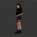 Woman in Black CHAOS T Shirt Black Shorts Fishnet Stockings Black Boots on Grey Background