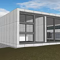 Modern Detached Villa With Concrete Exterior And Large Glass Windows On Grass Lawn