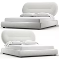 Elegant Modern Upholstered Double Bed With Curved Headboard And White Pillows