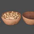 Fresh Potatoes in Earthenware Bowl with Another Empty Bowl and Two Beside
