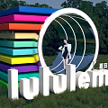 Lululemon 3D Letters With Rainbow Stripes Circular Structure And Female Model In Outdoor Green Grass