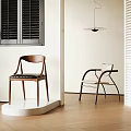 Modern Wooden And Metal Dining Chairs With Black Upholstered And White Seats In Showroom