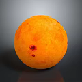 Ripe Orange Fruit With Smooth Surface And Red Spots On Gray Background