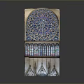 Intricate Arched Architectural Element With Stained Glass Panels And Ornamental Patterns