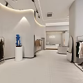 Modern Minimalist Clothing Store Interior With White Display Shelves Clothing Racks And Sofa