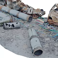 Rusted Metal Scrap Scattered With Pipes Frames And Broken Parts On Sandy Ground