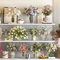 Decorative Vases With Various Fresh Flowers Displayed On Home Shelves