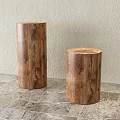 Two Natural Wooden Cylindrical Stools With Grain Pattern On Marble Floor