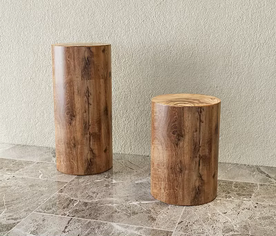 Two Natural Wooden Cylindrical Stools With Grain Pattern On Marble Floor 3d model