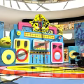 Vibrant Rock Themed Stage With Colorful Decorations Drums Speakers And Music Setup