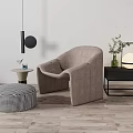Modern Lounge Chair With Checkered Ottoman Side Table Hanging Lamp And Potted Plant