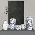 Blue And White Vases With Floral Patterns And Elephant Figurines On Decorative Shelf