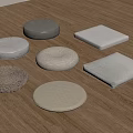 Various Shaped Floor Cushions With Neutral Textures On Wooden Floor
