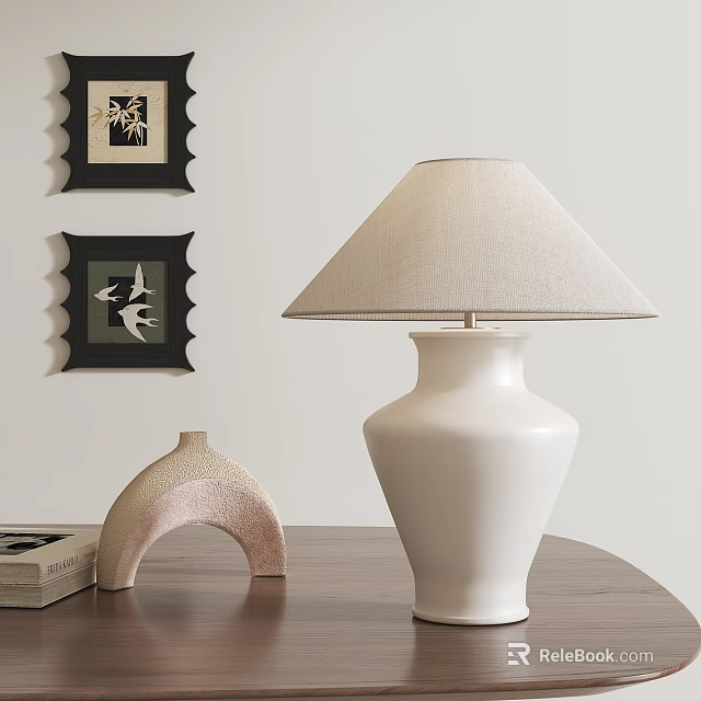 White Ceramic Table Lamp With Beige Linen Shade On Wooden Table And Decorative Wall Art 3d model 
