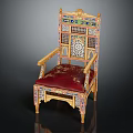 Ornate Traditional Chair with Intricate Carvings Red Cushion Golden Decorations and Colorful Inlays