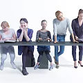 Five People Sitting and Standing Around Long Table With Books and Cup on White Background