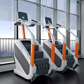 Stair Climber Exercise Equipment With White And Orange Design In Modern Gym With Large Windows