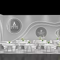Modern Exhibition Hall Interior With White Tables Chairs Circular Decor And Green Plants
