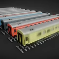 Colorful Model Train Cars in Various Colors Parked on Tracks with Windows