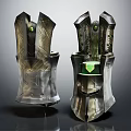 Ornate Metal Armor Pieces With Green Gemstones And Decorative Details
