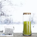 Transparent Inflatable Model With Green Liquid Ice Cubes And Snowy Window Background