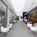 Modern Lounge Area Design With White Chairs Round Tables And Large Windows