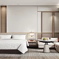 Hotel Guest Room With Large Bed White Bedding Sofa Area And Wooden Accents