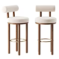 Modern Bar Stools With White Padded Seats And Backs Wooden Legs And Metal Footrest