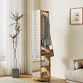 Wooden Clothes Rack With Hanging Clothes Bag And Potted Plant Near Window Blinds