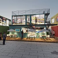Vibrant Commercial Street With Colorful Buildings Neon Signs And Outdoor Dining Areas