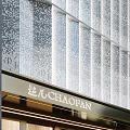 Modern CHAOBAO Storefront With Glass Door Illuminated Lighting Perforated Facade And Mannequin