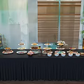 Coffee Break Area Featuring Black Tablecloth Tiered Dessert Stands Fresh Fruits And Beverages