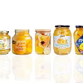 Assorted Glass Jars of Canned Fruits with Different Colorful Labels