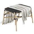Wooden Stool With Black Seat And Beige Fringed Blanket Draped Over