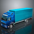 Blue Volvo Commercial Truck With Enclosed Cargo Box On Reflective Surface