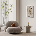 Striped Accent Chair With Round Cushion Green Plant Abstract Wall Art And Small Side Table